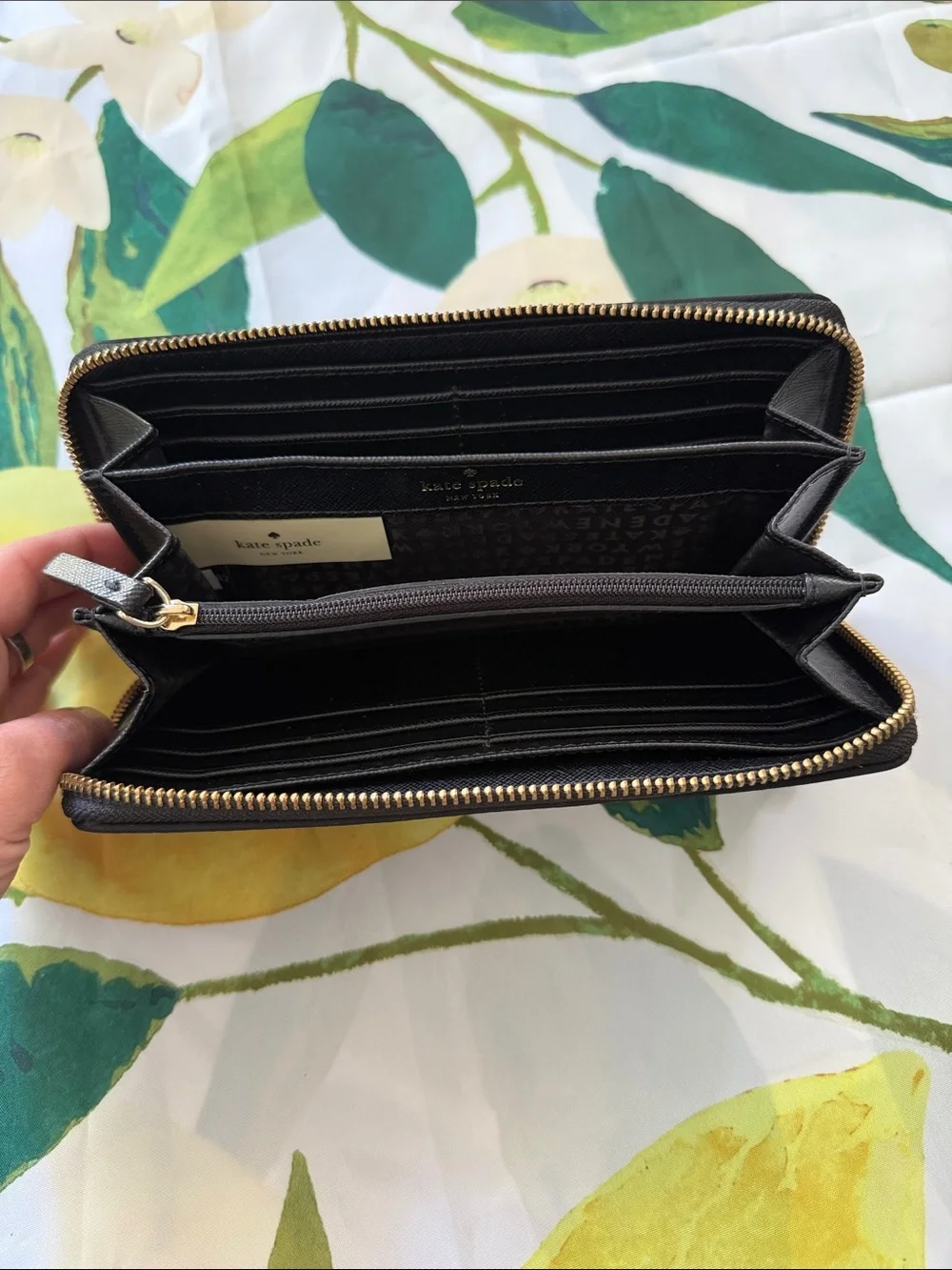 kate spade black zip-around wallet with gold plaque